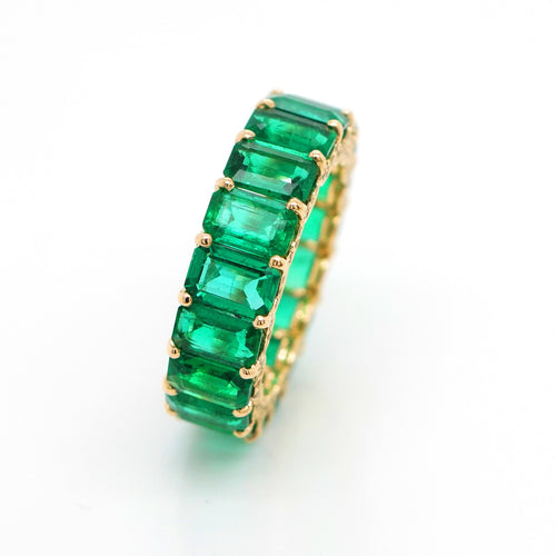 8.18 / 0.47 cts Octagon Emerald with Yellow Diamond Pavée Eternity Ring